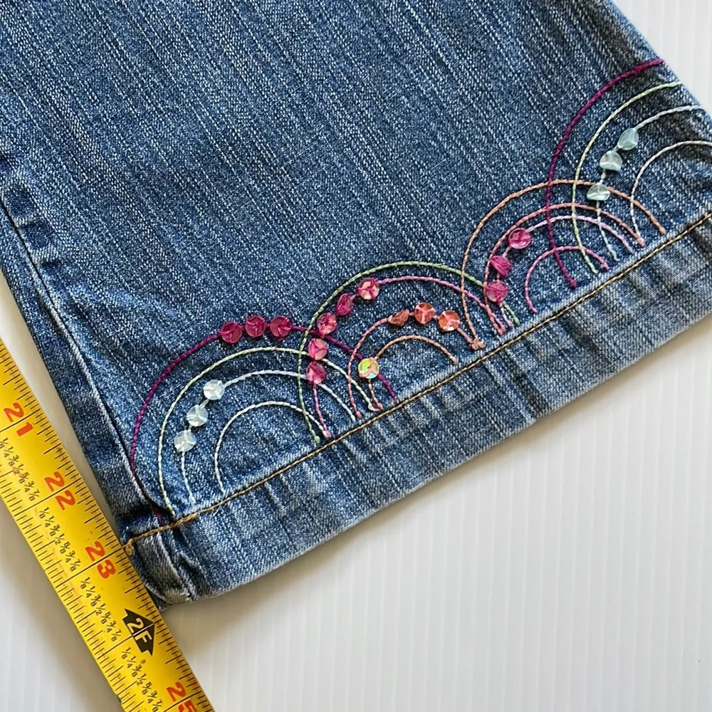 Flared Gymboree jeans with rainbow stitching & beading.  Girls size 9